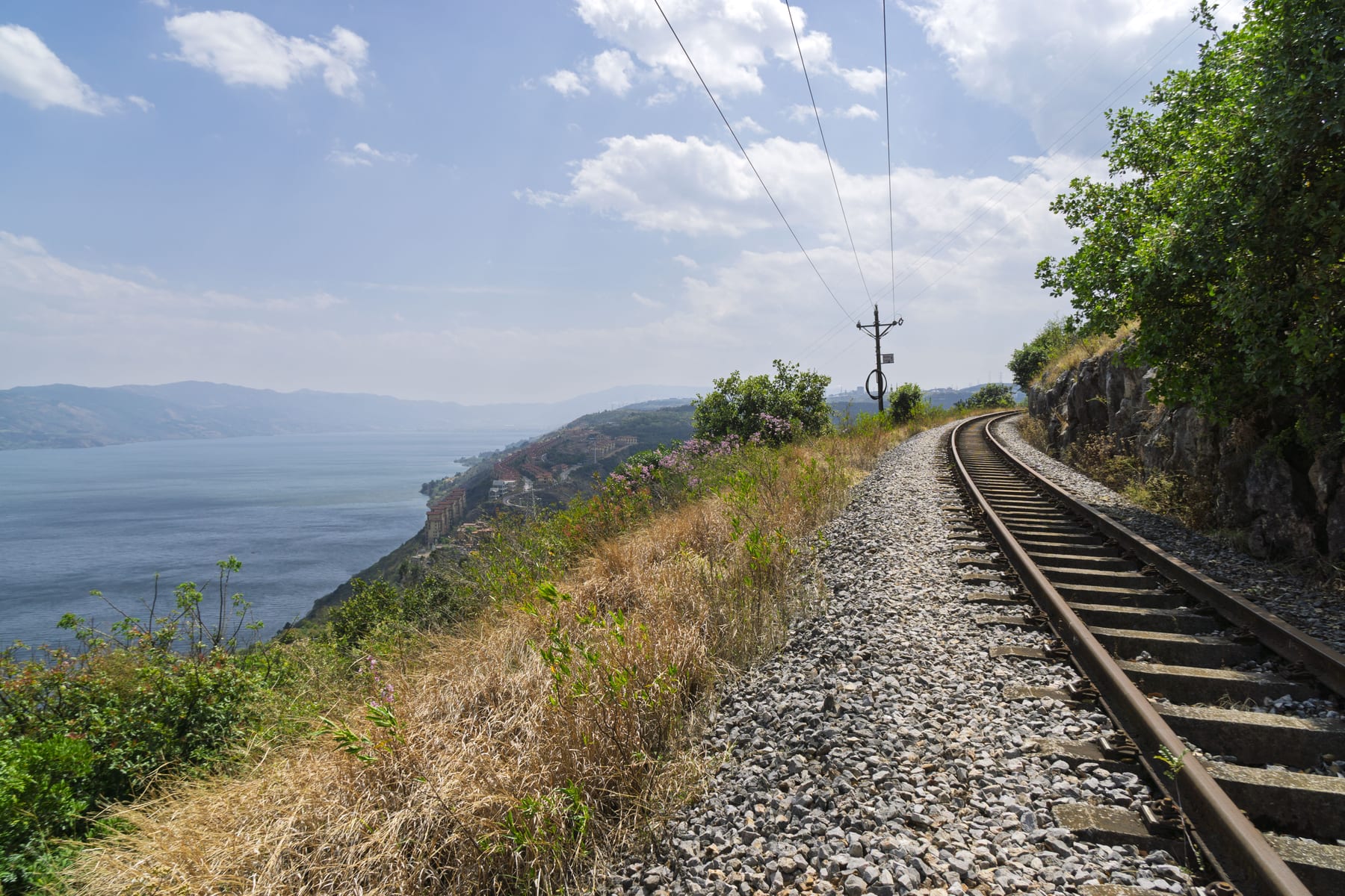 The old metre-gauge Yunnan–Vietnam Railway running along a bluff above Yangzonghai at Tangchi