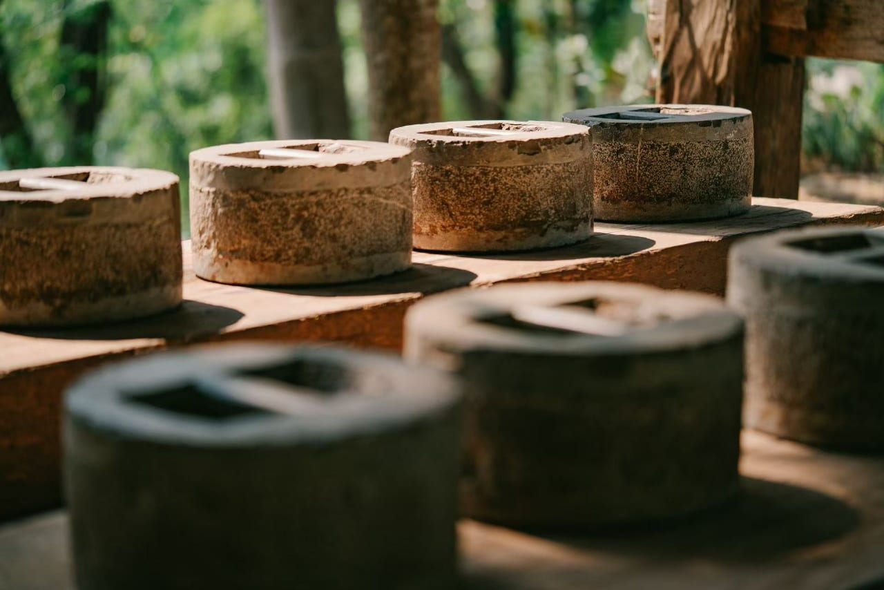Stone Pu'er pressing moulds lined up at the Bolian tea estate on Jingmai Mountain
