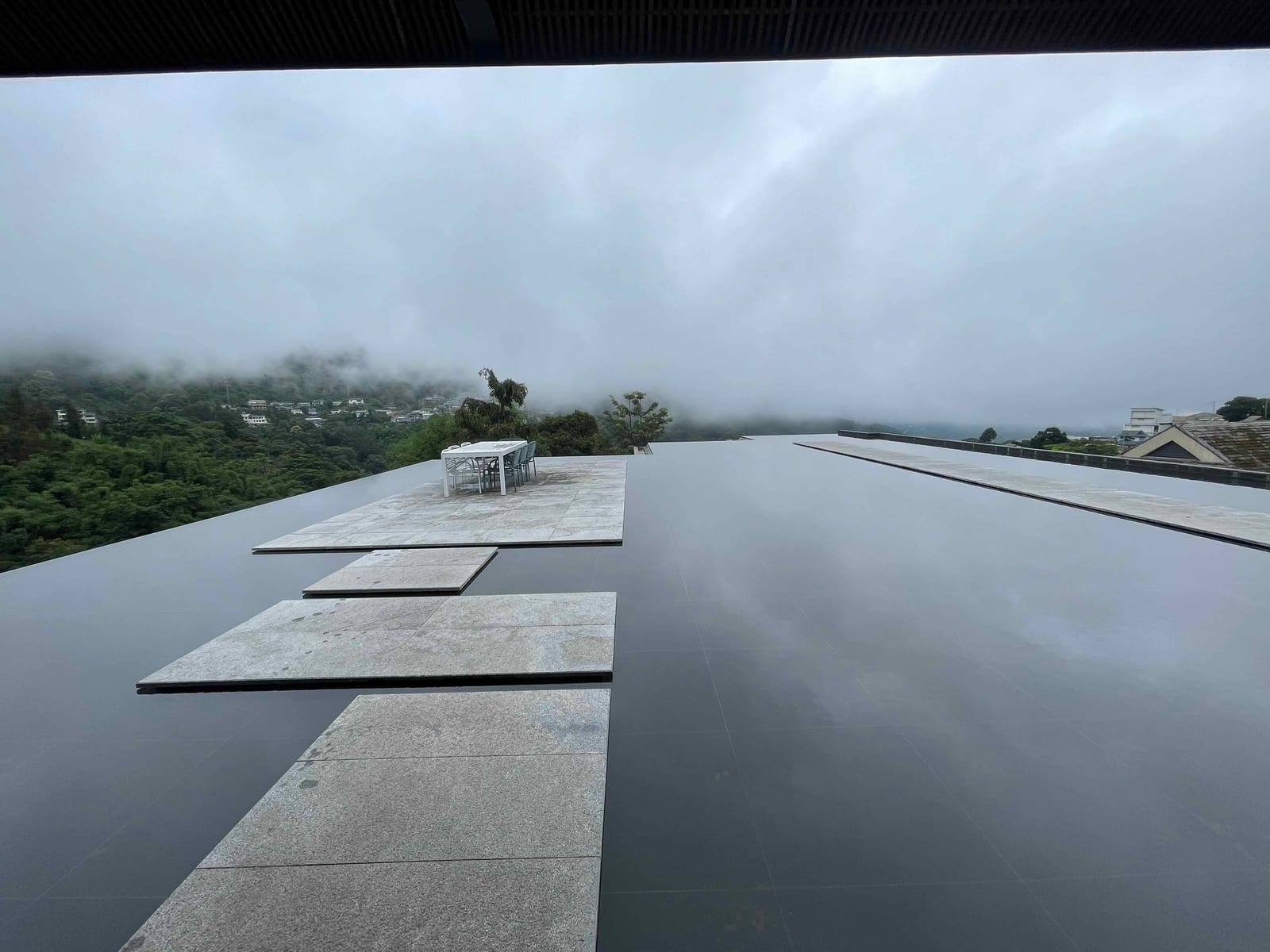 The sky-mirror terrace on Nannuo Mountain dissolving into low cloud