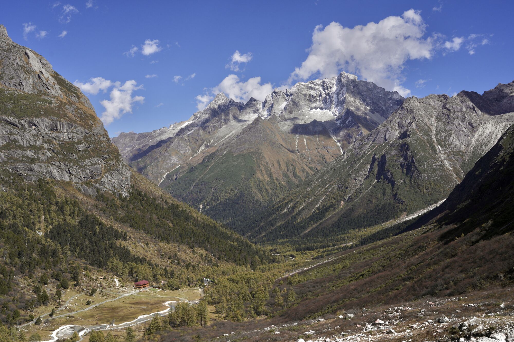 Bipeng Valley panorama with snow peak in the distance — exit walk