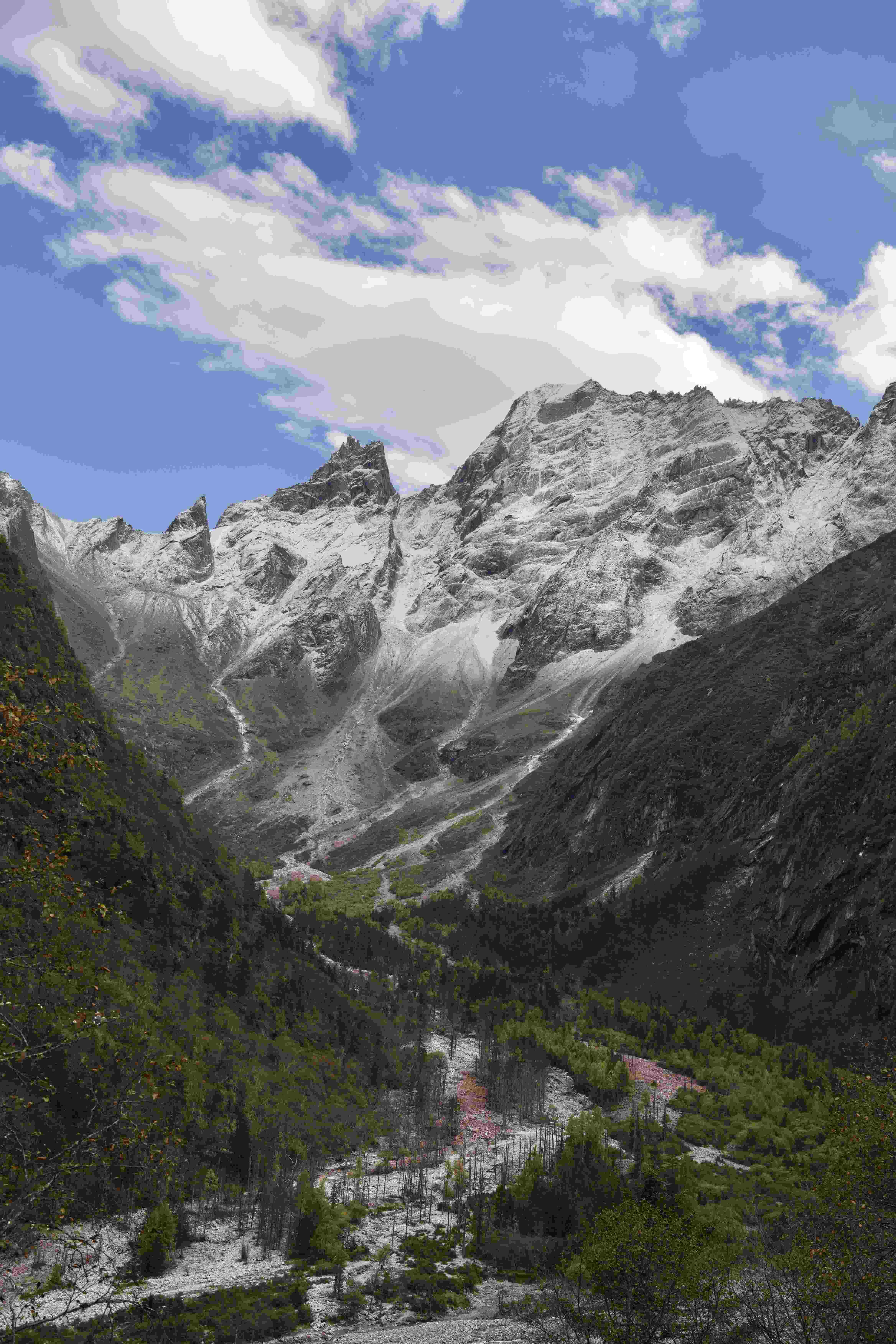 Snow-streaked Qionglai peaks rising above the Li–Xiao pass, West Sichuan