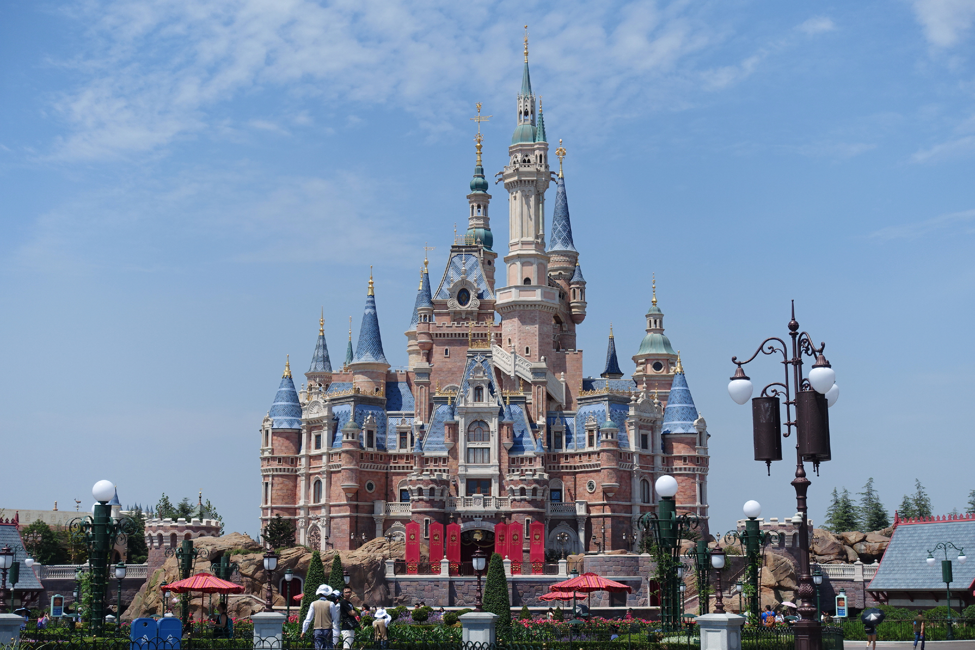 The Enchanted Storybook Castle rising under a wide blue sky at Shanghai Disneyland (上海迪士尼), Shanghai