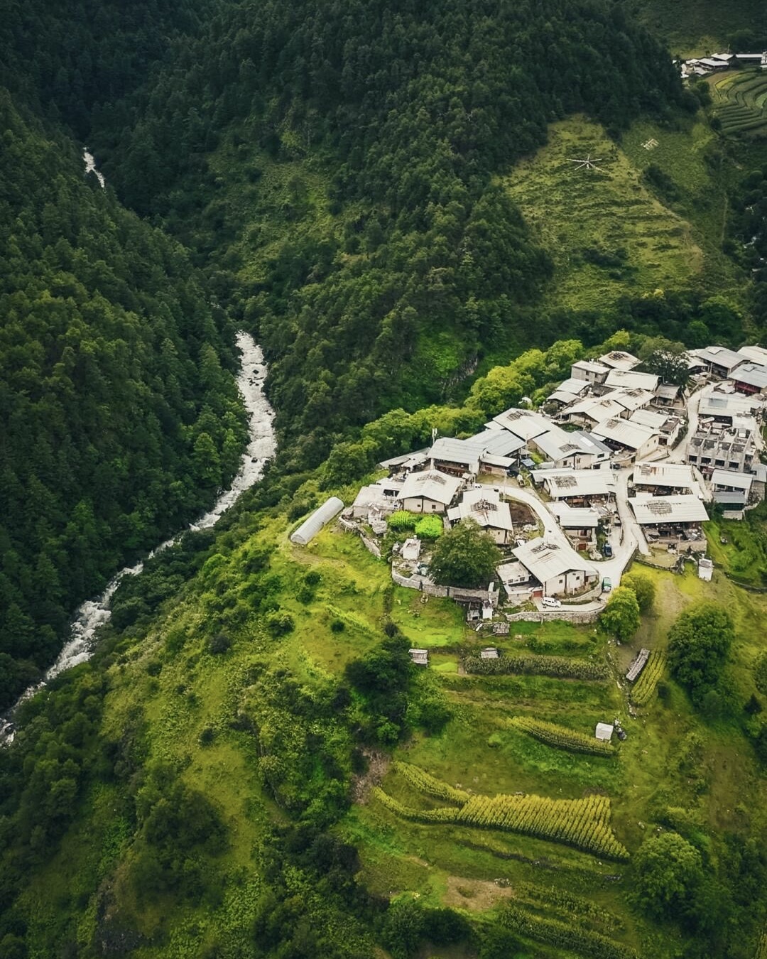 Hidden alpine valley overlook in Niru with a dramatic peak rising in golden light — hero image for the Niru Valley Hike by Boutique China