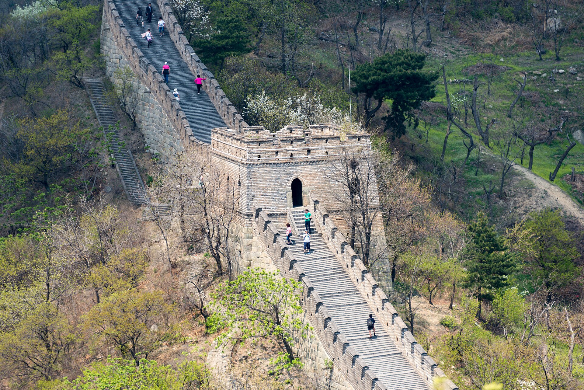The Great Wall at Mutianyu snaking along a forested ridge above Beijing — hero image for the Classic China tour by Boutique China