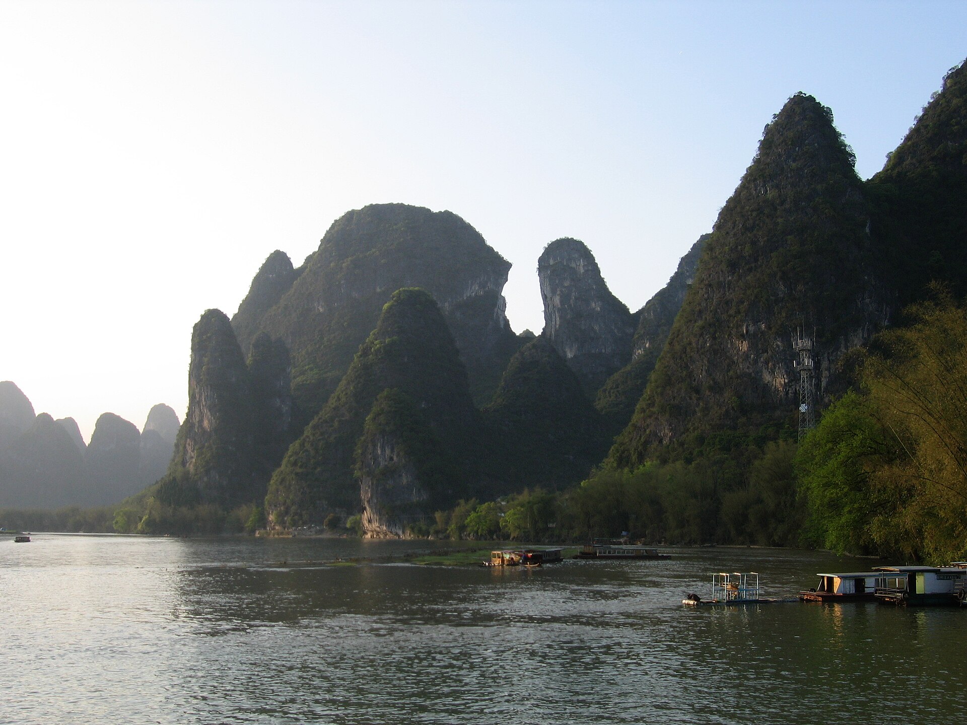 Golden light over the karst peaks of the Li River near Yangshuo — Classic China tour