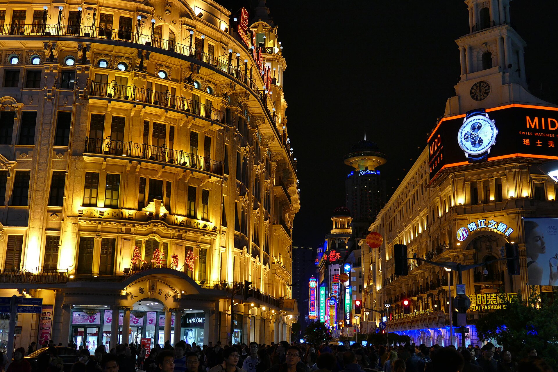 Heritage buildings and neon along Nanjing Road at night, Shanghai — Classic China tour