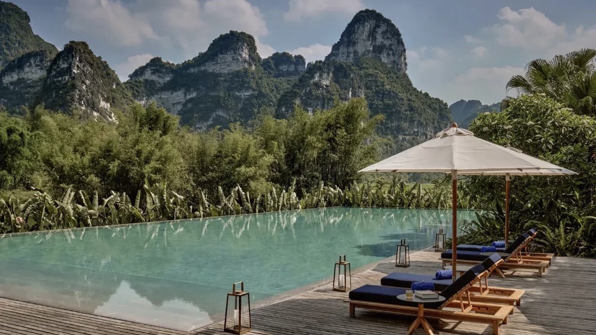 Infinity pool at a boutique Yangshuo resort looking out to Guilin's karst peaks