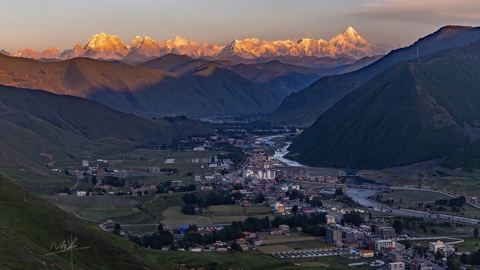 Valley light casting sacred geometry across the Xinduqiao landscape, West Sichuan