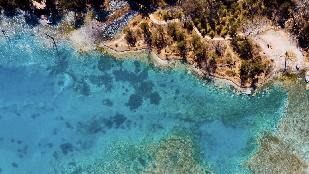 Turquoise glacial pool in Blue Moon Valley below Jade Dragon Snow Mountain — China's Last Frontier loop