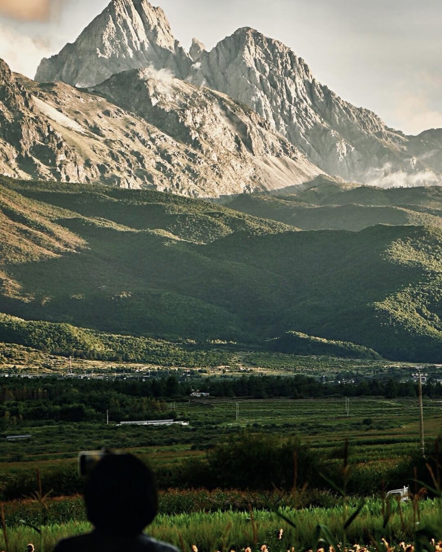 Full-frame view of Jade Dragon Snow Mountain's glacier ridge from the upper plateau — China's Last Frontier loop