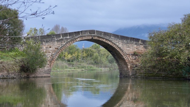 Historic stone arch bridge of the Ancient Tea Horse Road in Shaxi, Yunnan