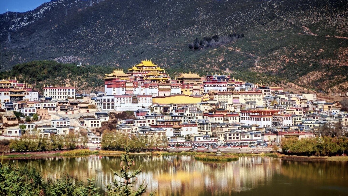 Songzanlin Monastery's golden roofs glowing on the Tibetan plateau outside Shangri-La — China's Last Frontier loop