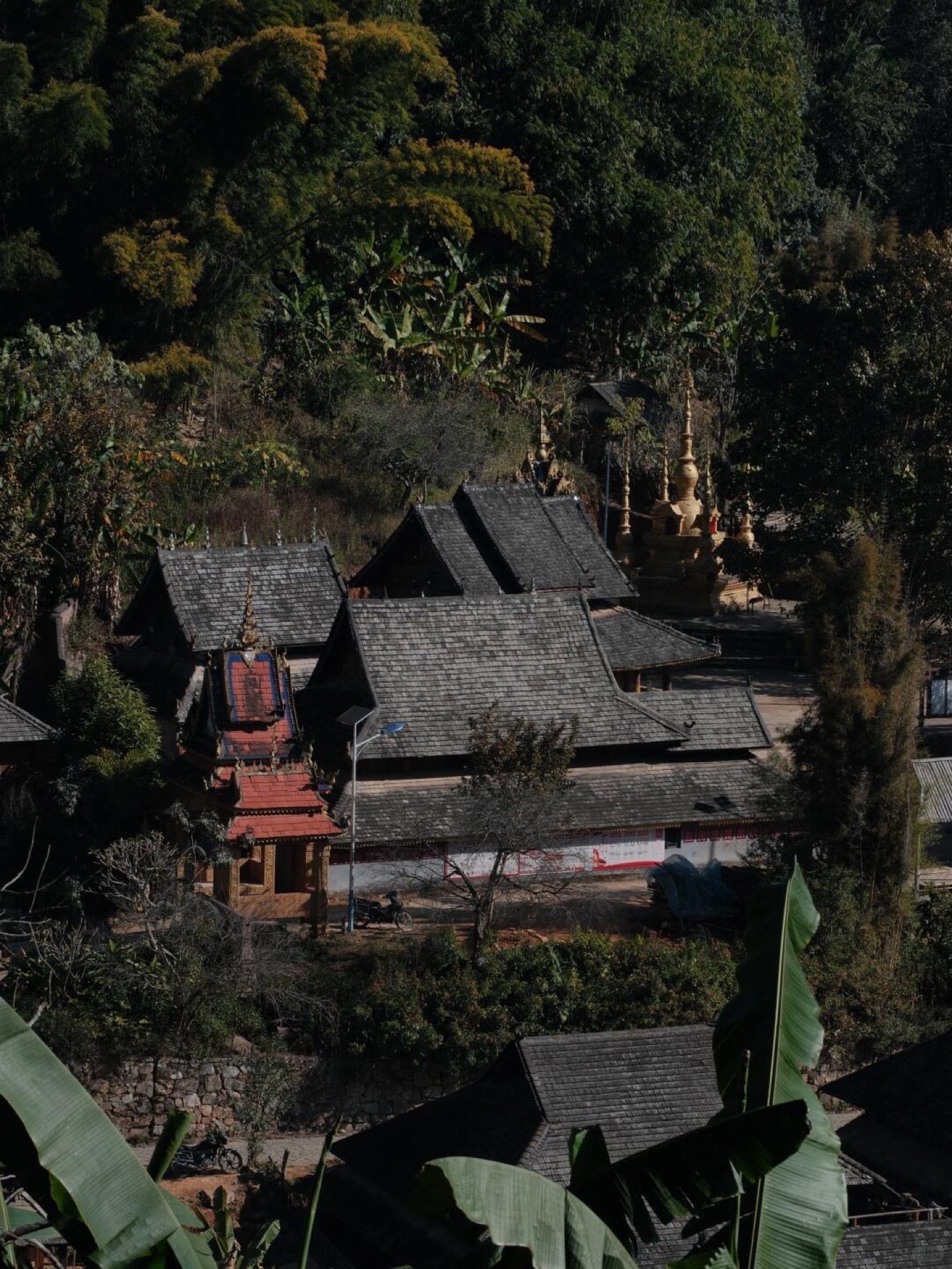 Gilded ancient Dai Buddhist temple at Mengben village — one of the heritage villages inside the UNESCO Jingmai cultural landscape