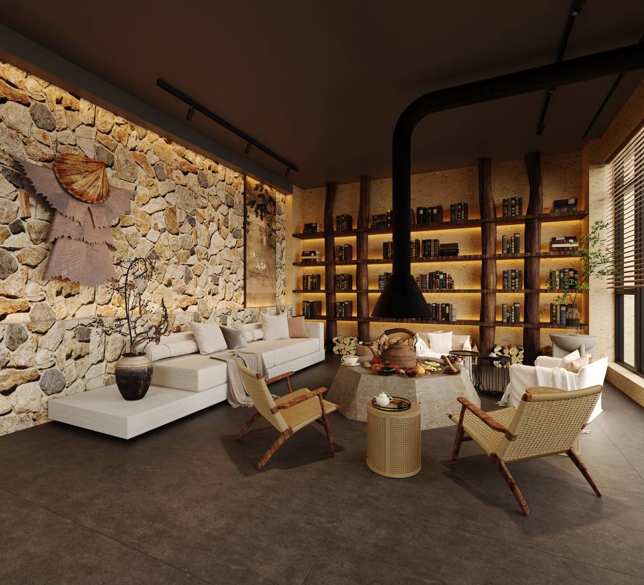 Daotian Lixiang — the stone-and-timber lounge and library with a rough stone wall, timber bookshelves, wood-burning stove and tea laid out