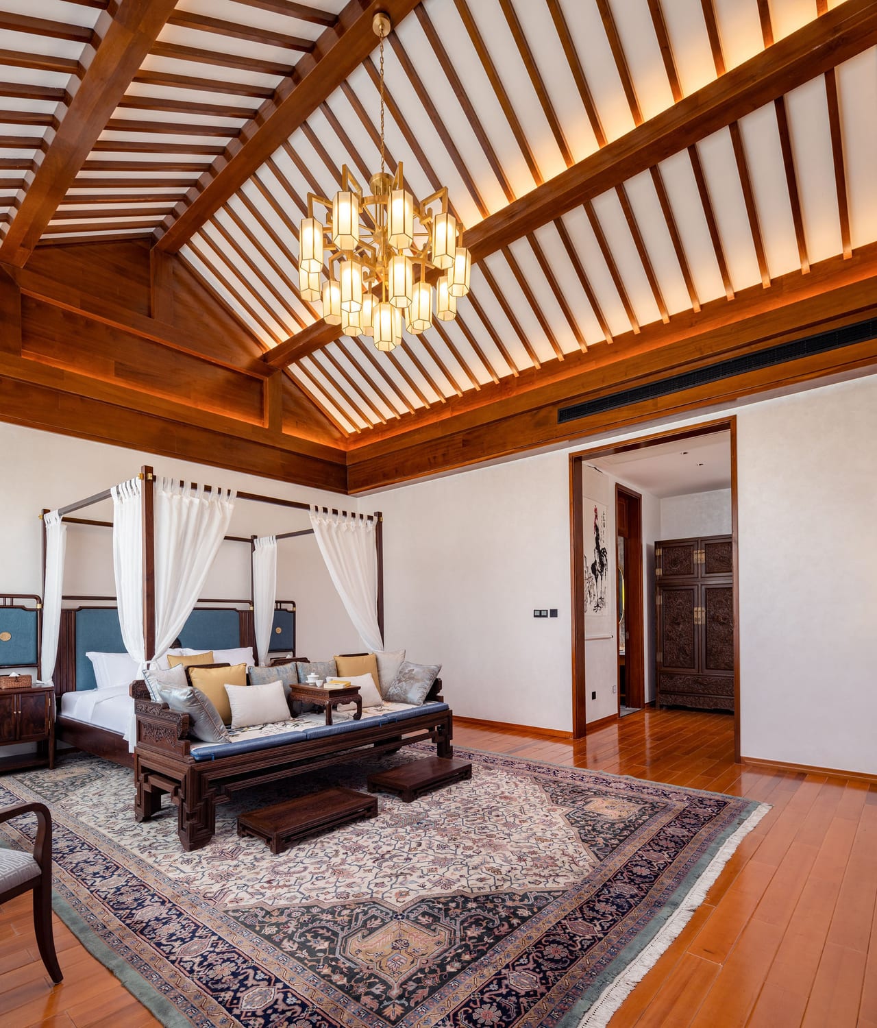 He Ting · Awamei — suite with a canopied rosewood bed under an exposed timber roof