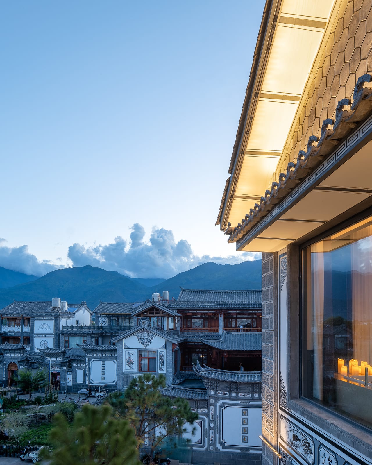 The view from a Kasion Erhai suite balcony — Xizhou rooftops and the Cang Mountains