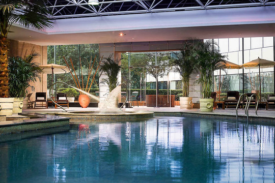 Sofitel Xi'an on Renmin Square (西安索菲特人民大厦) — the outdoor pool set in the hotel's leafy gardens