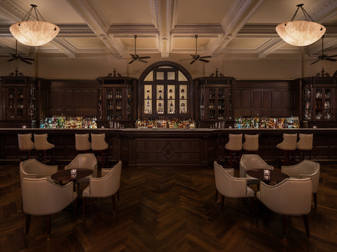 Waldorf Astoria Shanghai — the Long Bar lounge with club chairs and heritage panelling