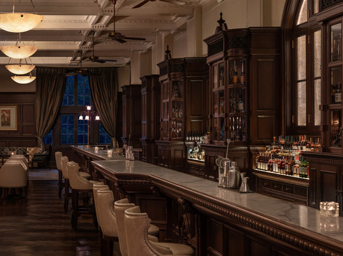 Waldorf Astoria Shanghai — the restored Long Bar, all dark wood and old-Shanghai glamour