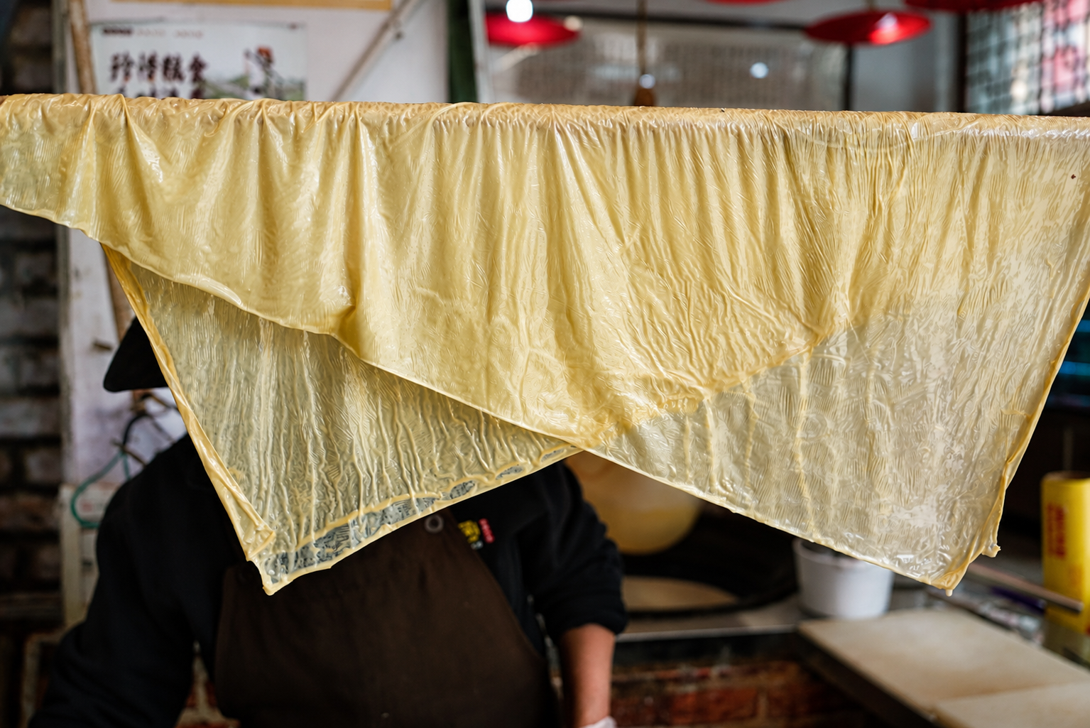 Fresh tofu skin drying at a local workshop
