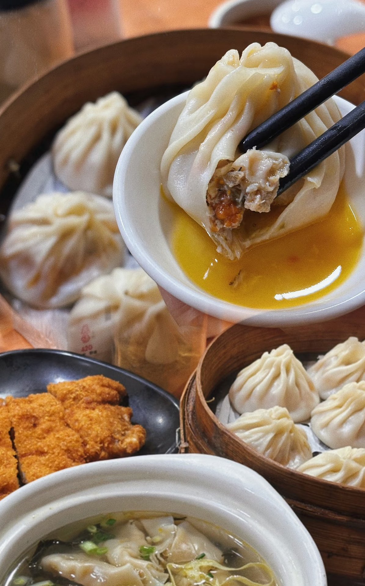 Xiaolongbao soup dumplings with a pork cutlet and wonton soup