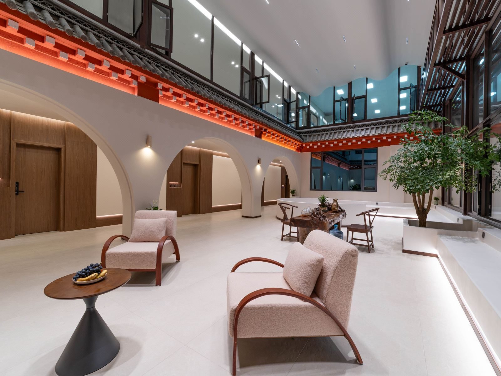 Runhai Yunqi — the top-lit atrium lounge under a red-beamed gallery