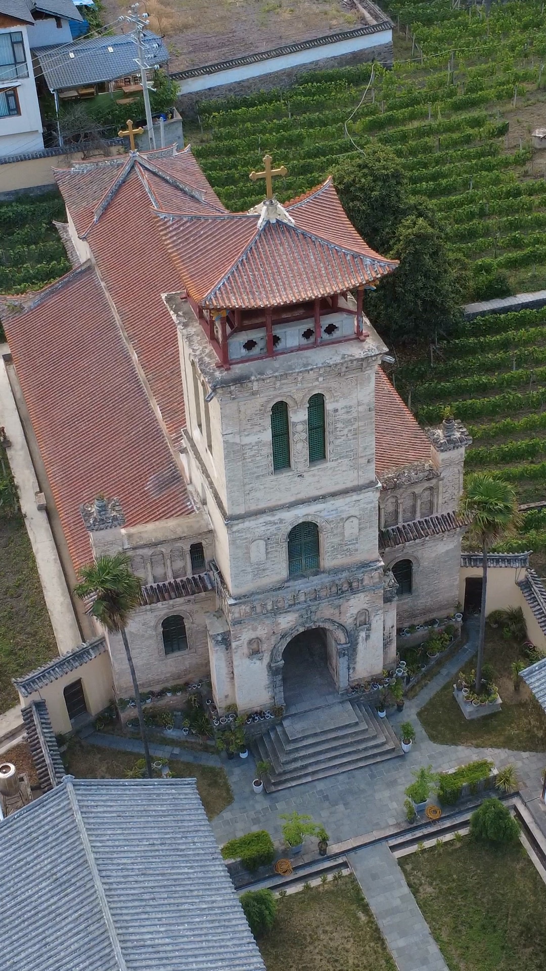 Cizhong's mission church among the vineyard rows