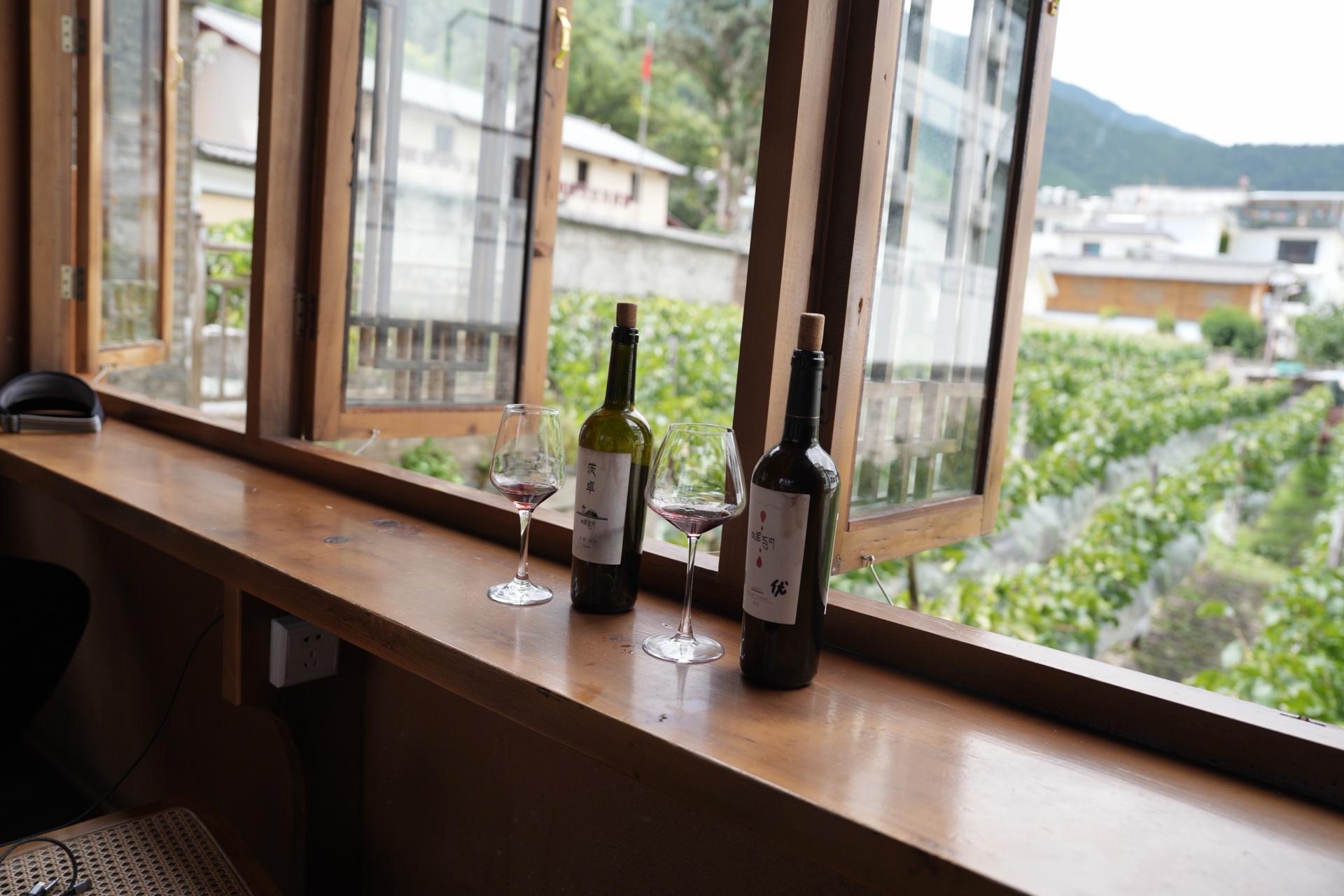 Cizhong wine tasted at the window over the vineyard