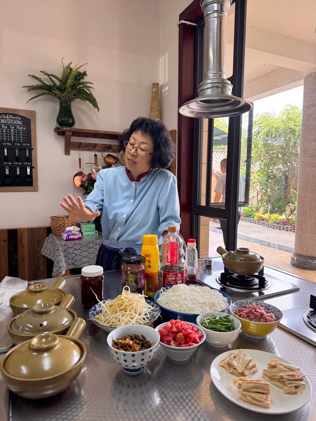 Chef Fancy Wu at her kitchen bench with the day's ingredients laid out